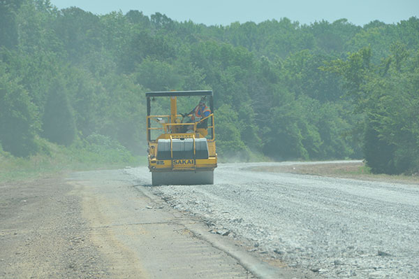 There are multiple ways to rehabilitate the Interstate highways in Arkansas. In the photo above the old, worn-out concrete was pulverized and is being compacted by a roller to form a good base for the new roadway pavement.